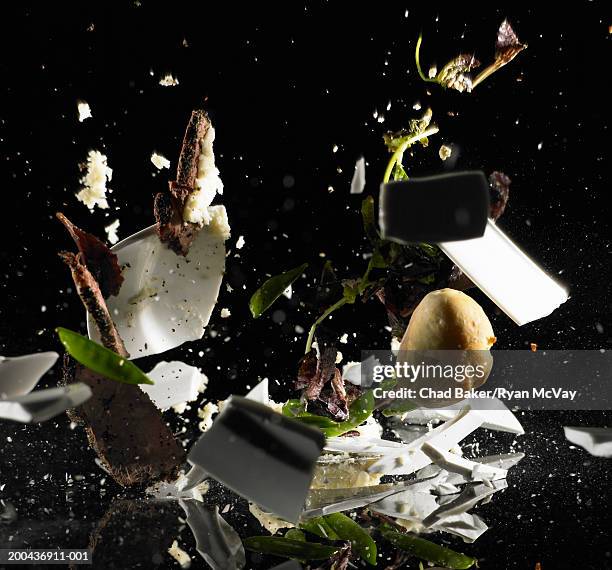 plate of meat, mashed potatoes, salad and roll shattering on floor - breaking bread stock pictures, royalty-free photos & images