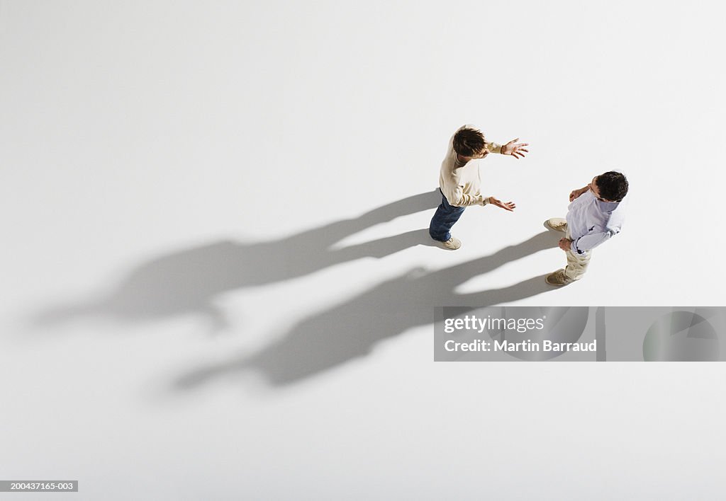 Two men having discussion, overhead view