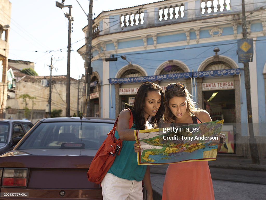 Two young woman looking at map