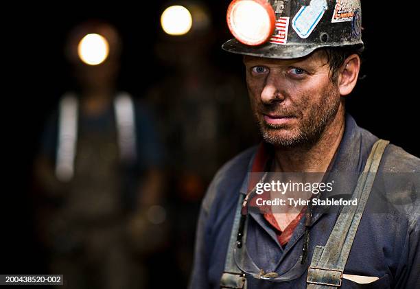 coal miner in mine, portrait, close-up - mining helmet stock pictures, royalty-free photos & images