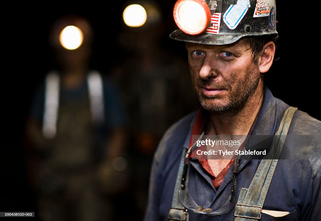 Coal miner in mine, portrait, close-up