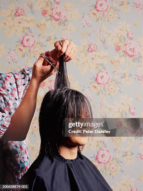 mature woman having hair cut, smiling - black hair stylist stock pictures, royalty-free photos & images