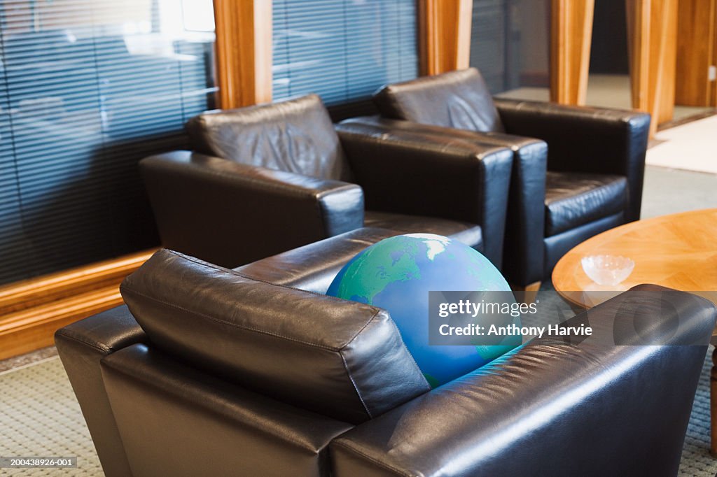 Globe on chair in office