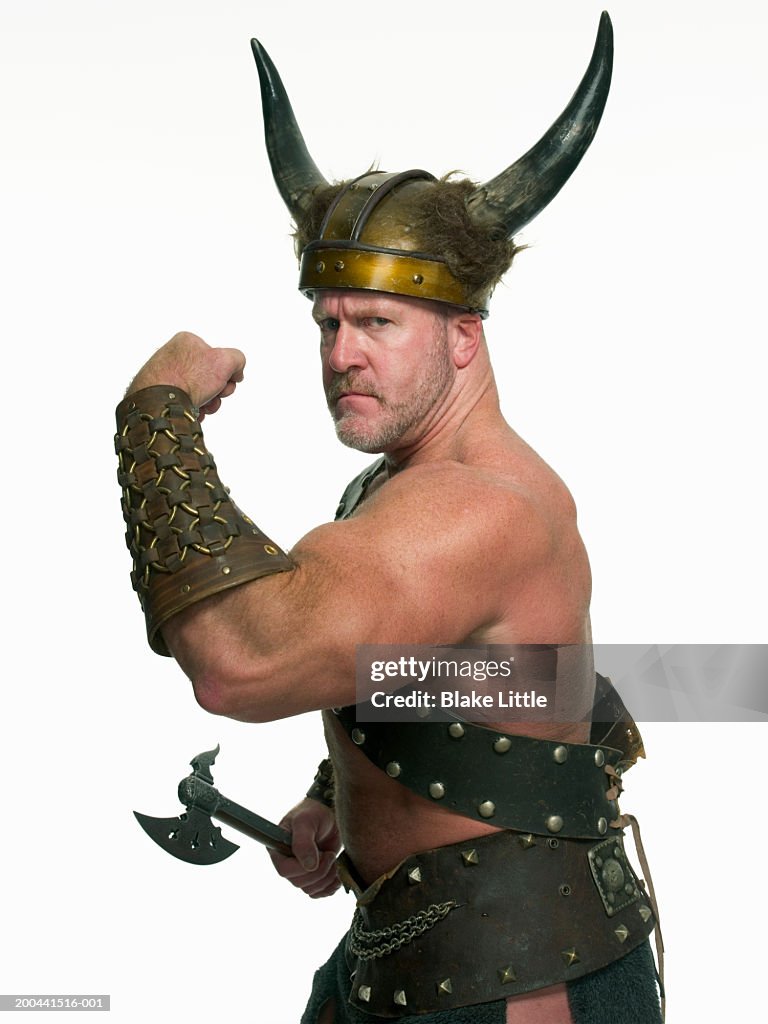 Man in viking costume flexing bicep