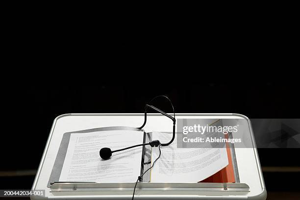 microphone and notes on lectern - presentation folder stock pictures, royalty-free photos & images