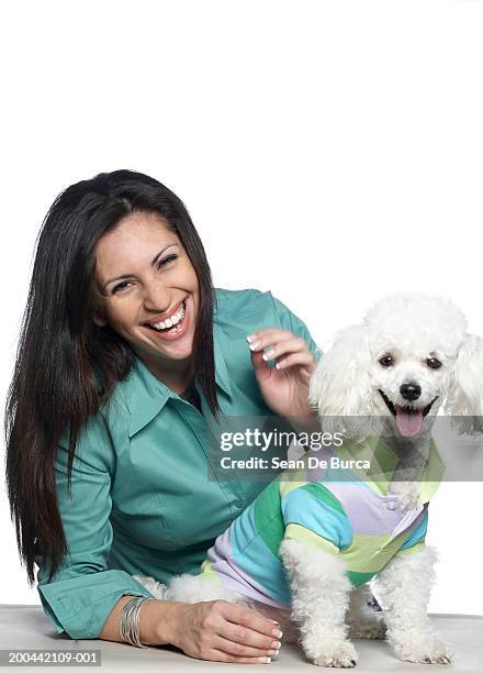 woman  with bichon frise wearing striped polo shirt, portrait - dog coat stock pictures, royalty-free photos & images
