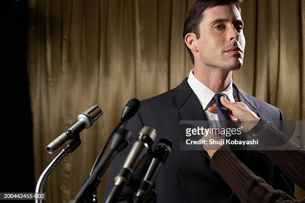 man being made up before giving speech - political talk stock-fotos und bilder