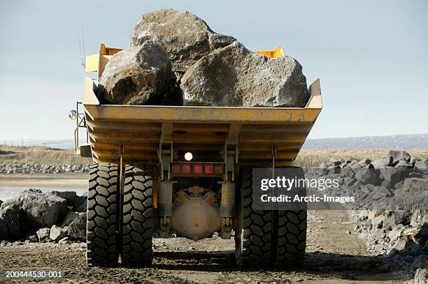 rocks in dump truck, rear view - dump truck stock pictures, royalty-free photos & images