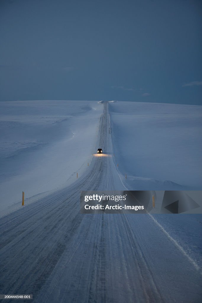 Car driving on snow road