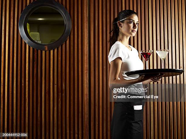 waitress carrying tray with drinks - waitress stock pictures, royalty-free photos & images