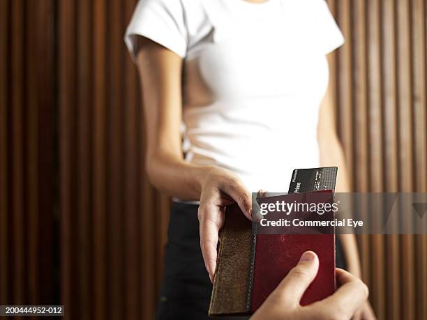 waitress returning credit card to diner, mid section - restaurant bill stock pictures, royalty-free photos & images