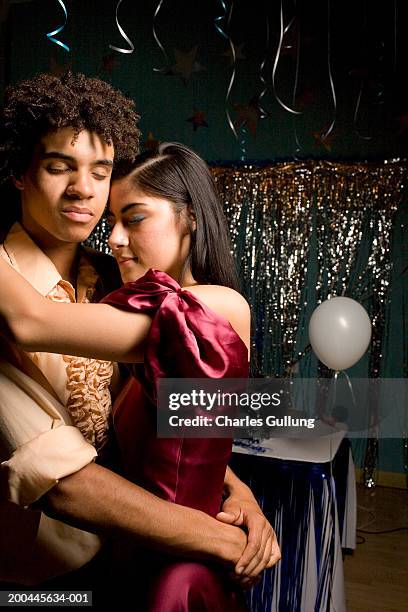 teenage boy and girl (16-18) dancing at prom, eyes closed, side view - prom dancing stock pictures, royalty-free photos & images