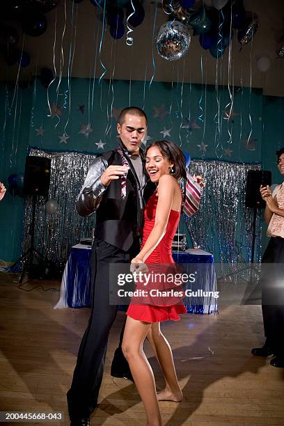 teenage boy and girl (15-18) in formalwear dancing at prom - prom dancing stock pictures, royalty-free photos & images