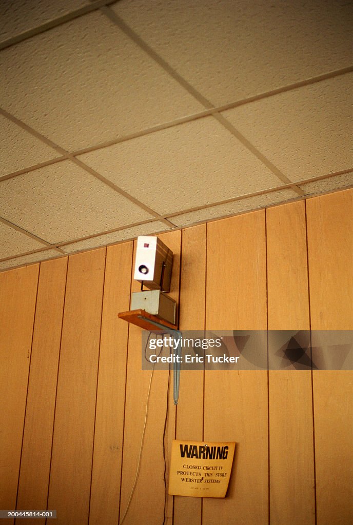 Security camera mounted on wall