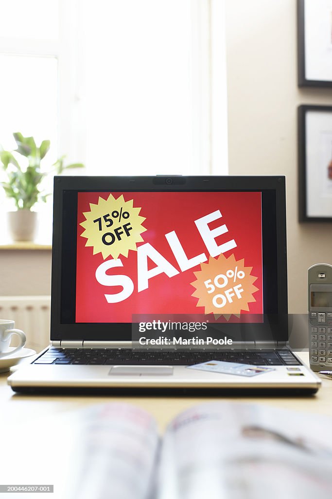 Sale advertisment on screen of laptop