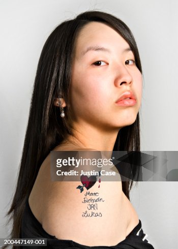 Teenage Girl With Tattoo On Upper Arm Portrait Closeup High-Res Stock Photo  - Getty Images