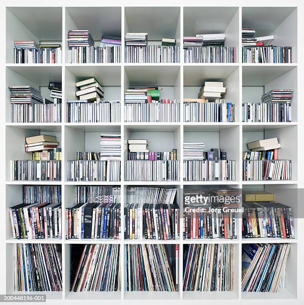 cds, dvds and records on shelves - dvd fotografías e imágenes de stock