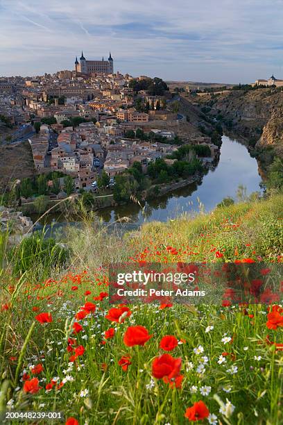 spain, toledo, cityscape, the alcazar and tagus river - river tagus stock pictures, royalty-free photos & images