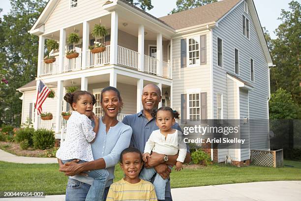 parents and children (18 months to 7) in front of home, portrait - family in front of home fotografías e imágenes de stock