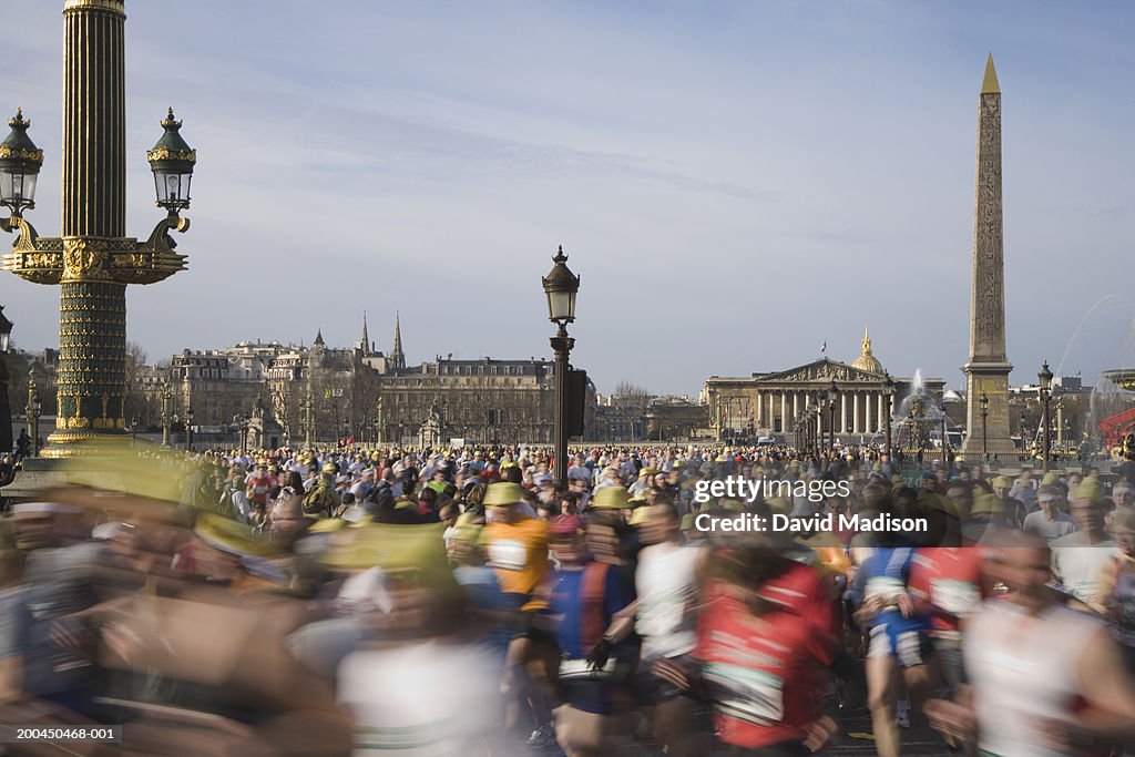 France, Paris, runners in Paris Marathon crossing Place de la Concorde