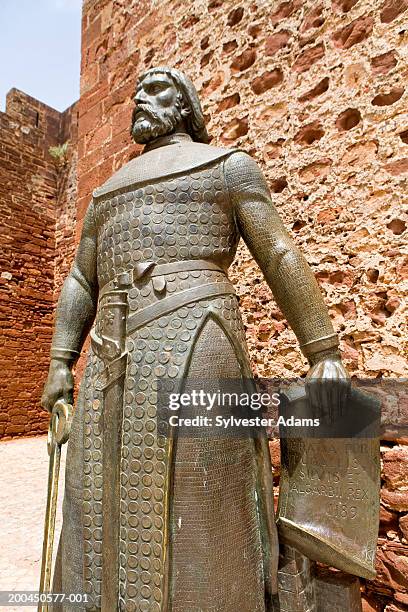 portugal, algarve, silves, close-up of statue outside moorish castle - silves portugal stock pictures, royalty-free photos & images