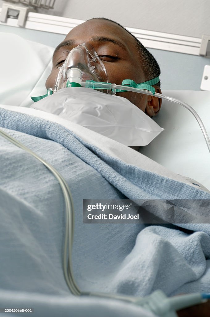 Male Patient Wearing Oxygen Mask In Hospital Bed Eyes Closed High-Res Stock Photo Getty Images