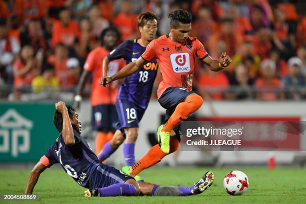 Mateus Castro of Omiya Ardija is tackled by Toshihiro Aoyama of Sanfrecce Hiroshima during the J.League J1 match between Omiya Ardija and Sanfrecce...