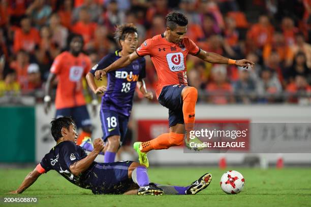 Mateus Castro of Omiya Ardija is tackled by Toshihiro Aoyama of Sanfrecce Hiroshima during the J.League J1 match between Omiya Ardija and Sanfrecce...