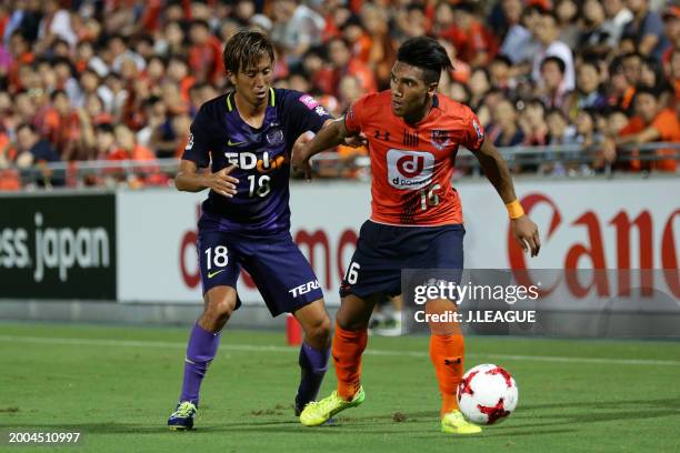 Mateus Castro of Omiya Ardija controls the ball against Yoshifumi Kashiwa of Sanfrecce Hiroshima during the J.League J1 match between Omiya Ardija...