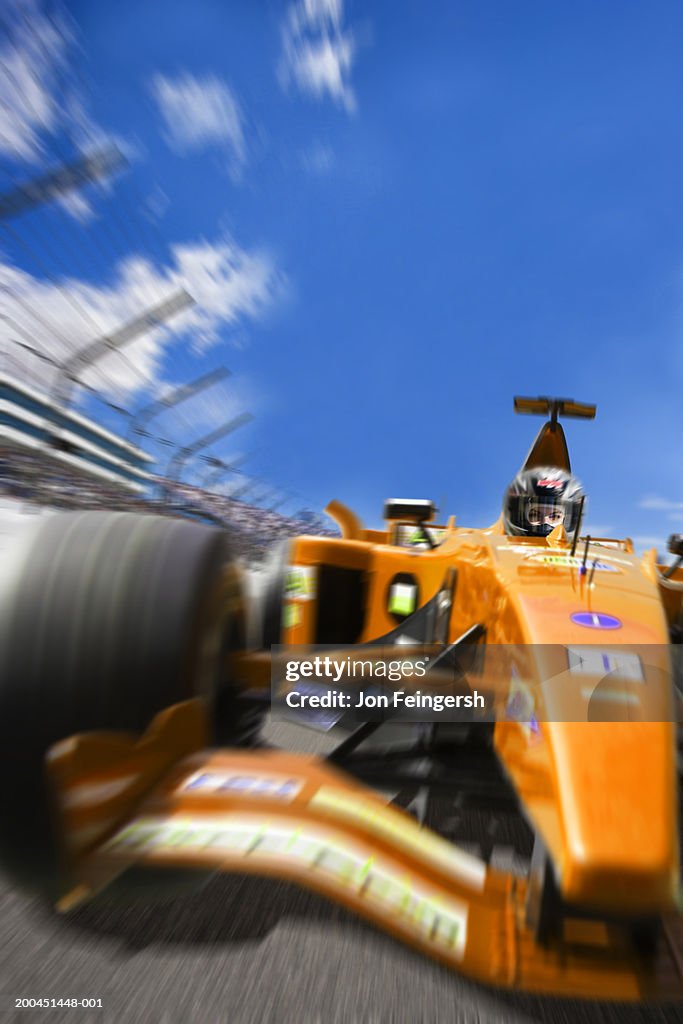 Woman driving open-wheel single-seater racing car race car (Digital Composite)