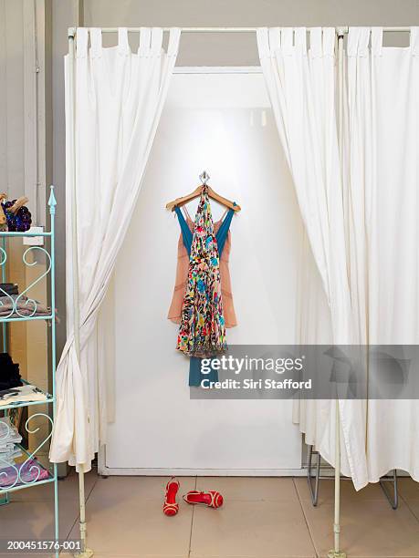 clothes hanging in dressing room - fitting room stock pictures, royalty-free photos & images