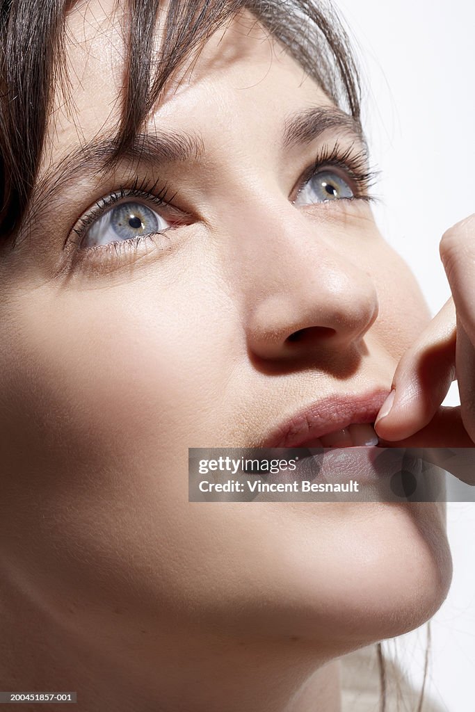 Young woman looking up, close-up