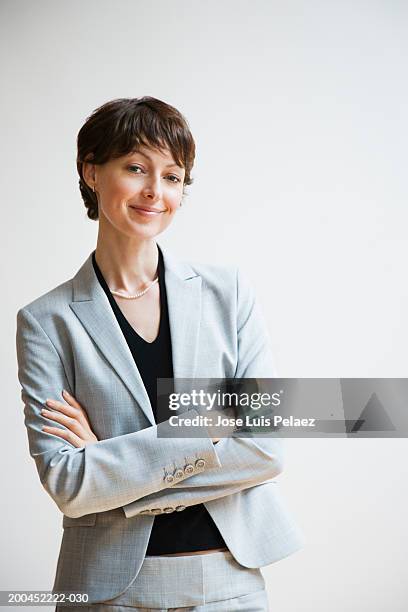 businesswoman smiling, portrait - smart studio shot stock pictures, royalty-free photos & images
