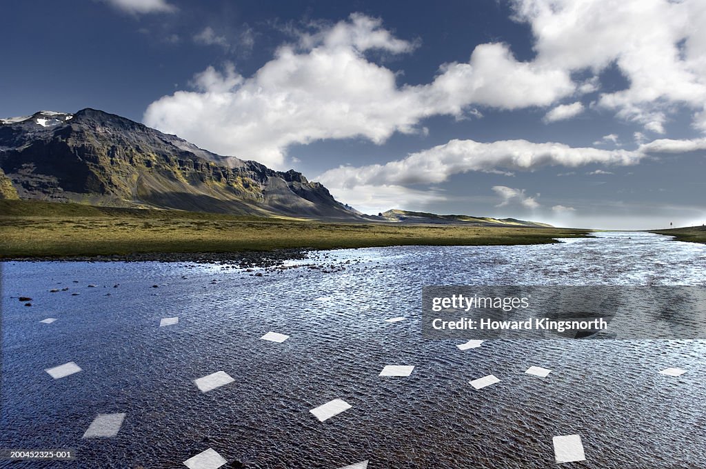 Paper sheets drifting in river