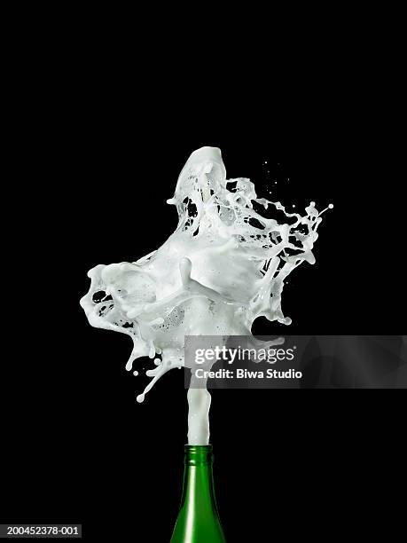 champagne spraying from bottle - spraying champagne stock pictures, royalty-free photos & images