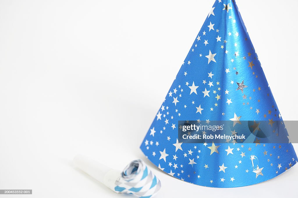 Party hat and party horn blower (focus on party hat)