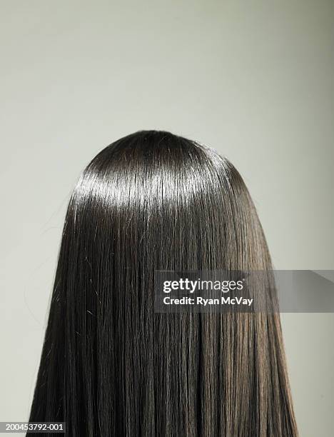 young woman with long hair, rear view - woman with straight hair stock pictures, royalty-free photos & images