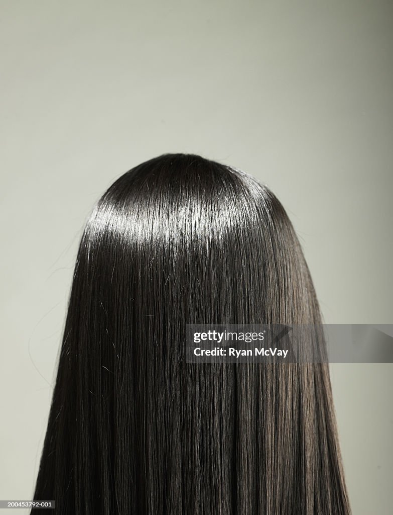 Young woman with long hair, rear view