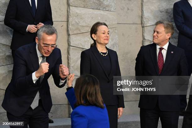 Secretary General Jens Stoltenberg, US Permanent Representative to NATO Julianne Smith and Britain's Defense Minister Grant Shapps prepare for a...