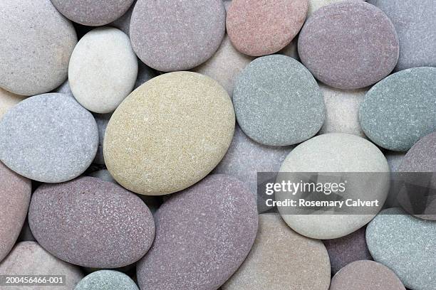 pebbles on beach, close-up - rock background stock pictures, royalty-free photos & images