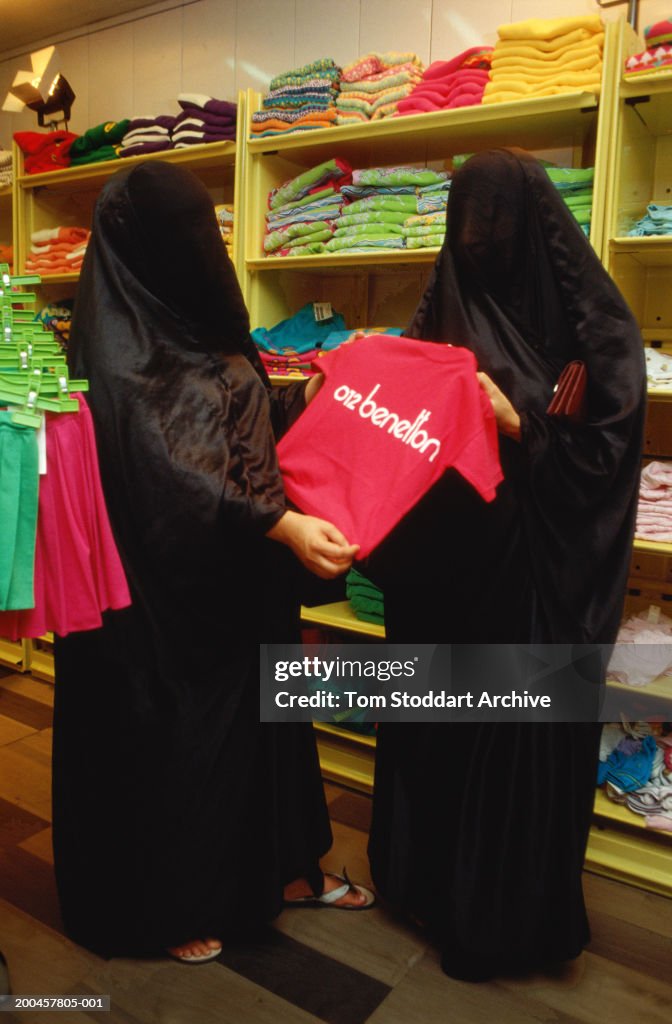 Women in burka, clothes shopping.