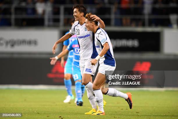 Shun Nagasawa of Gamba Osaka celebrates with teammate Hwang Ui-jo after scoring the team's second goal during the J.League J1 match between Sagan...