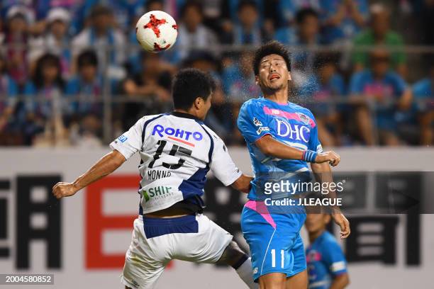 Yohei Toyoda of Sagan Tosu and Yasuyuki Konno of Gamba Osaka compete for the ball during the J.League J1 match between Sagan Tosu and Gamba Osaka at...