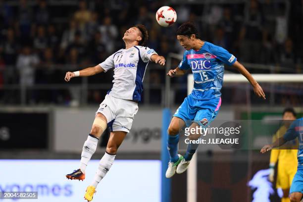 Hwang Ui-jo of Gamba Osaka and Jung Seung-hyun of Sagan Tosu compete for the ball during the J.League J1 match between Sagan Tosu and Gamba Osaka at...