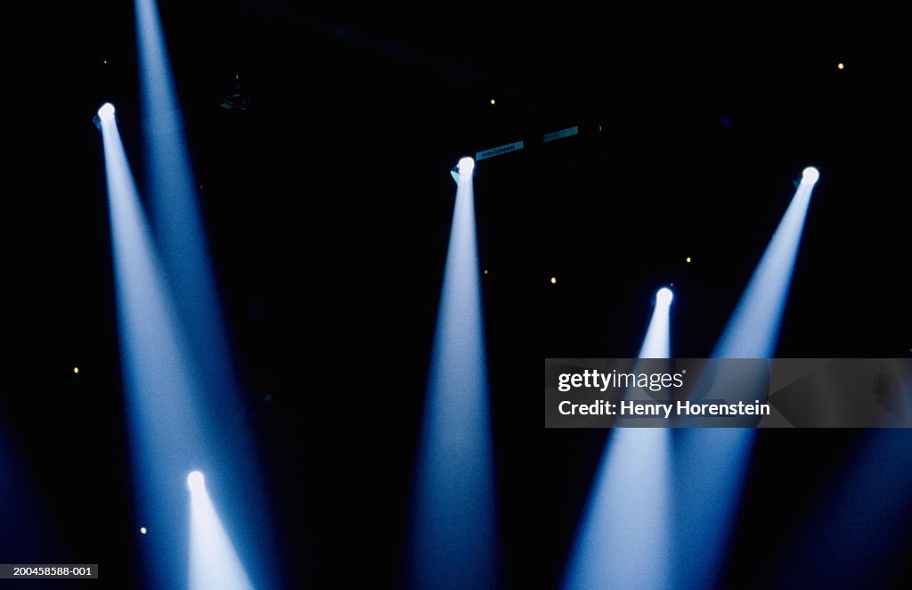 Multiple spotlights in dark room, low angle view