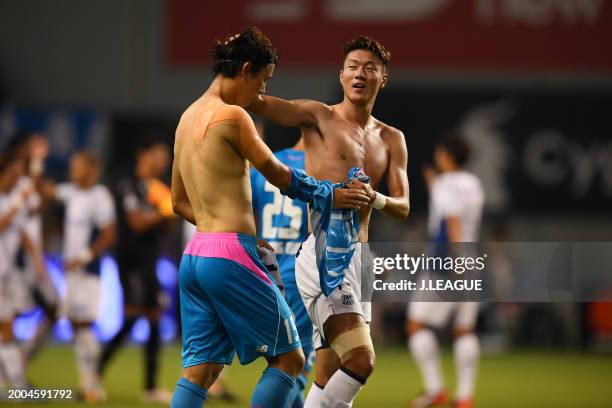 Jung Seung-hyun of Sagan Tosu and Hwang Ui-jo of Gamba Osaka exchange shirts after the J.League J1 match between Sagan Tosu and Gamba Osaka at Best...