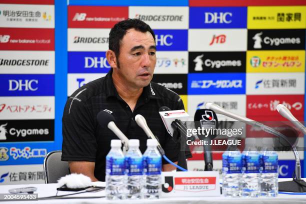 Head coach Kenta Hasegawa of Gamba Osaka speaks at the post match press conference after the J.League J1 match between Sagan Tosu and Gamba Osaka at...