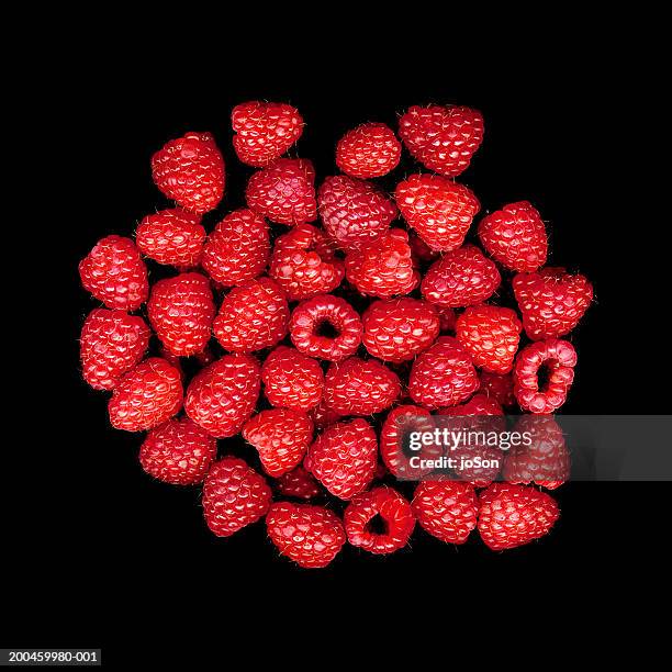 raspberries against black background, close-up - raspberry stock pictures, royalty-free photos & images
