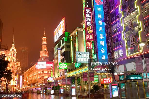 china, shanghai, neon-lit street at night - neon sign ストックフォトと画像