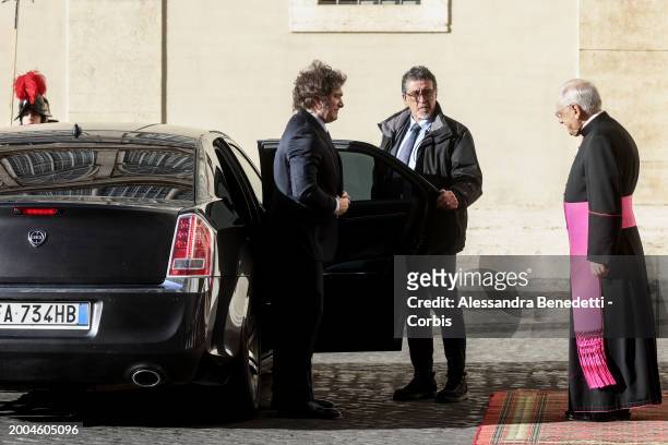 Argentina's President Javier Milei is greeted by the regent of the Papal Household Leonardo Sapienza at San Damaso Court prior a meeting with Pope...